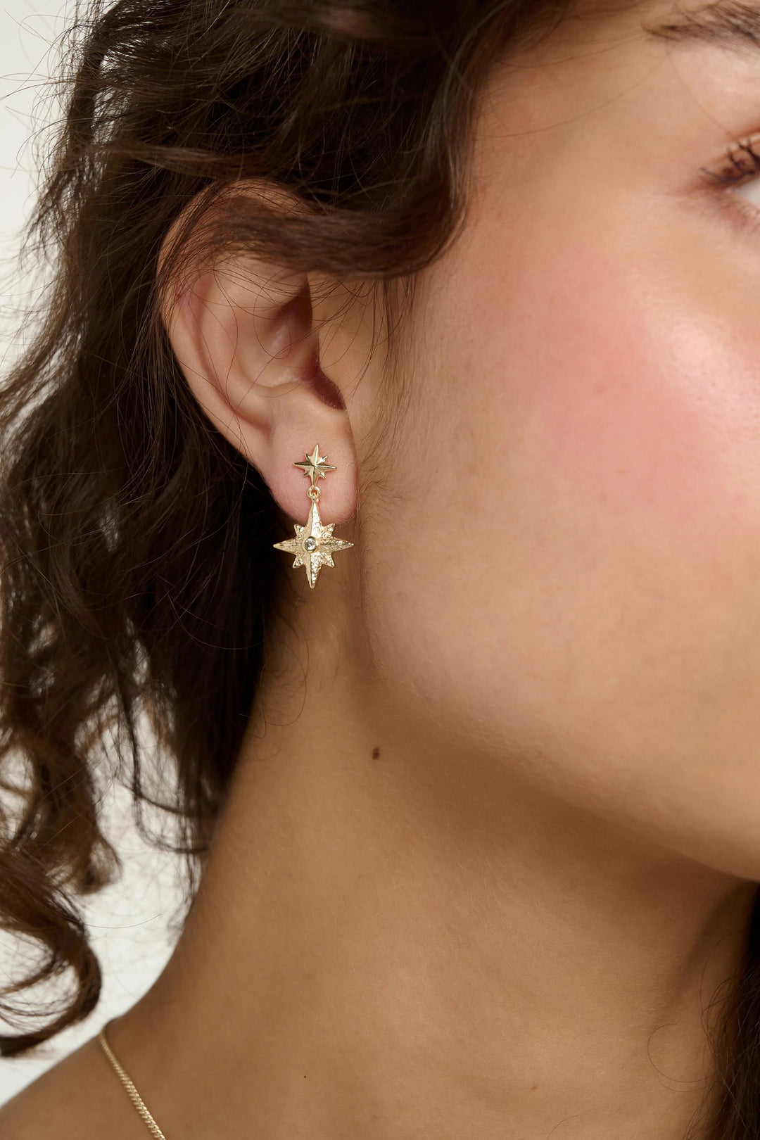 Gold Nightfall Earrings by Tutti &amp; Co featuring elegant, handcrafted jewelry with intricate detailing.