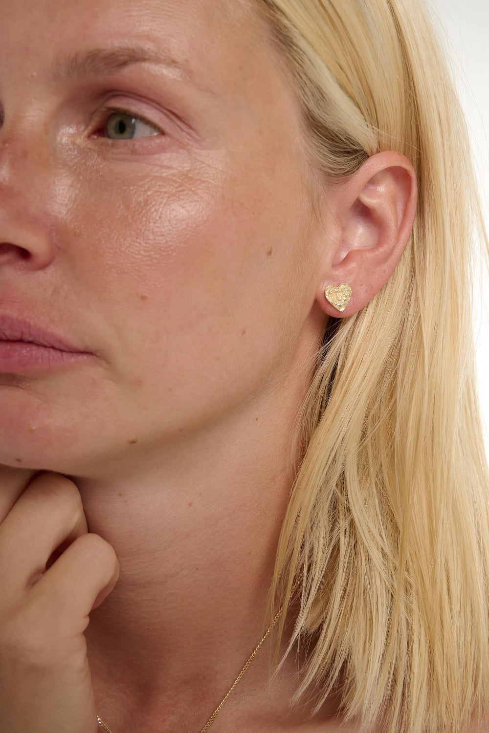 Small gold Revere earrings by Tutti & Co, featuring a delicate design, displayed on a white background.