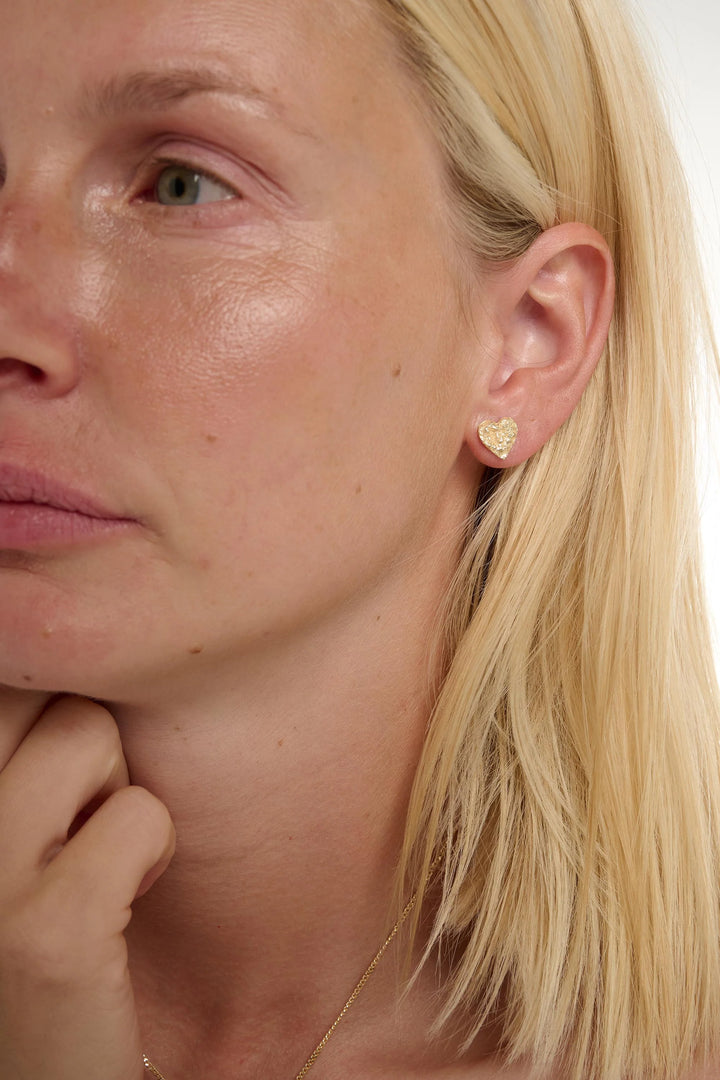 Small gold Revere earrings by Tutti &amp; Co, featuring a delicate design, displayed on a white background.