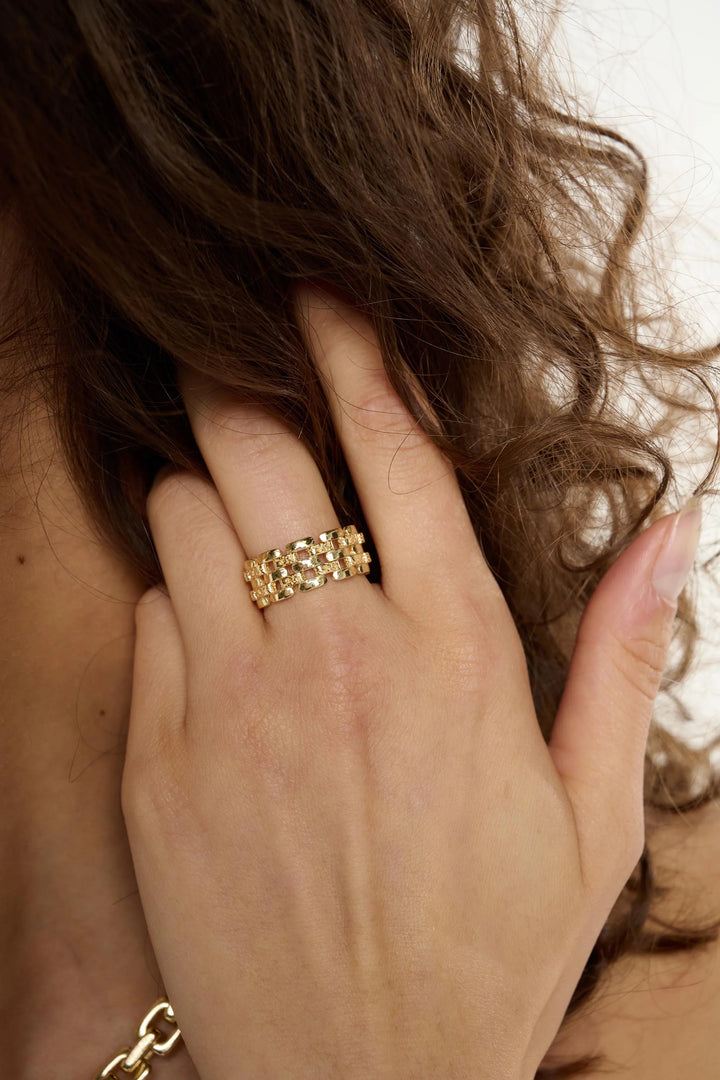 Medium Tutti &amp; Co linear ring from Cornucopia Home and Gift, showcasing a sleek, modern metal design on a neutral background.