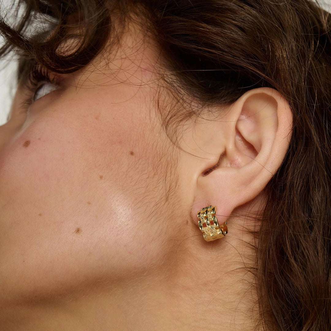 Gold linear earrings by Tutti &amp; Co featuring sleek, minimalist design, perfect for stylish and elegant jewelry accessories.
