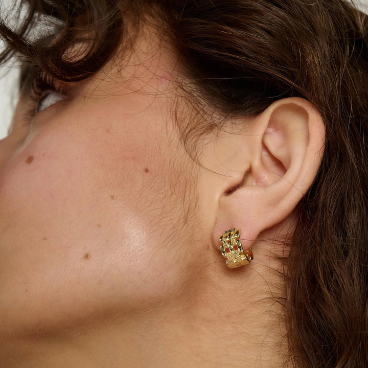 Gold linear earrings by Tutti &amp; Co featuring sleek, minimalist design, perfect for stylish and elegant jewelry accessories.