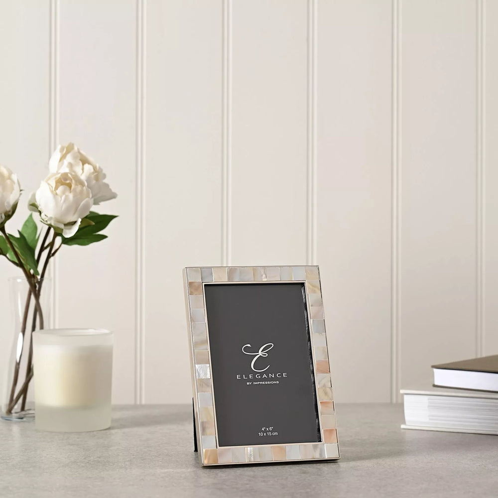 Elegant metal photo frame with mother of pearl inlay by Widdop & Co, designed for 4x6 inch pictures.