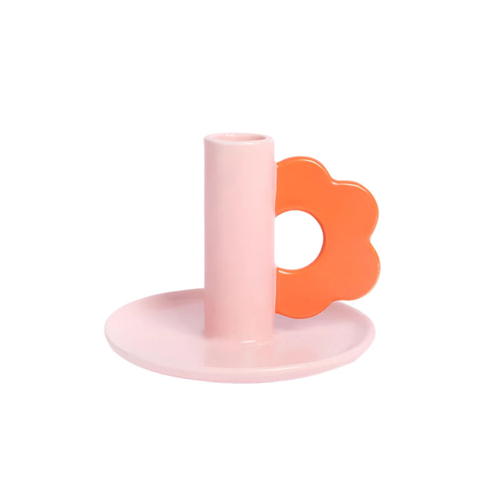 Pink flower-shaped candle holder by Caroline Gardner, designed for gifts, featuring floral details and a decorative display.
