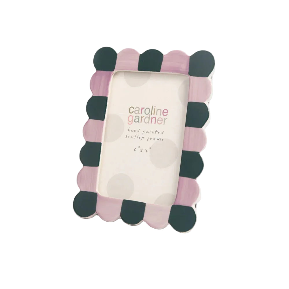 Polka dot photo frame with 'caroline gardner' branding on a white background