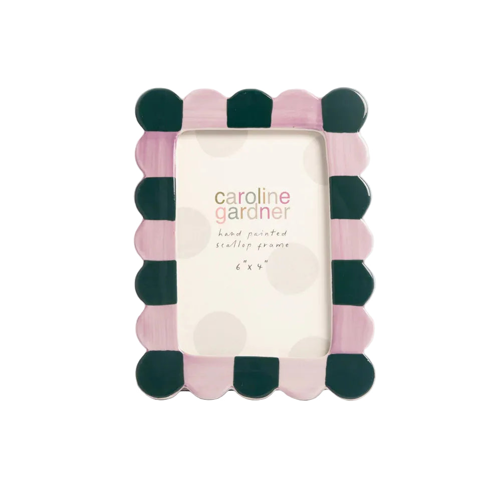 Polka dot picture frame with 'caroline gardner' branding on a white background