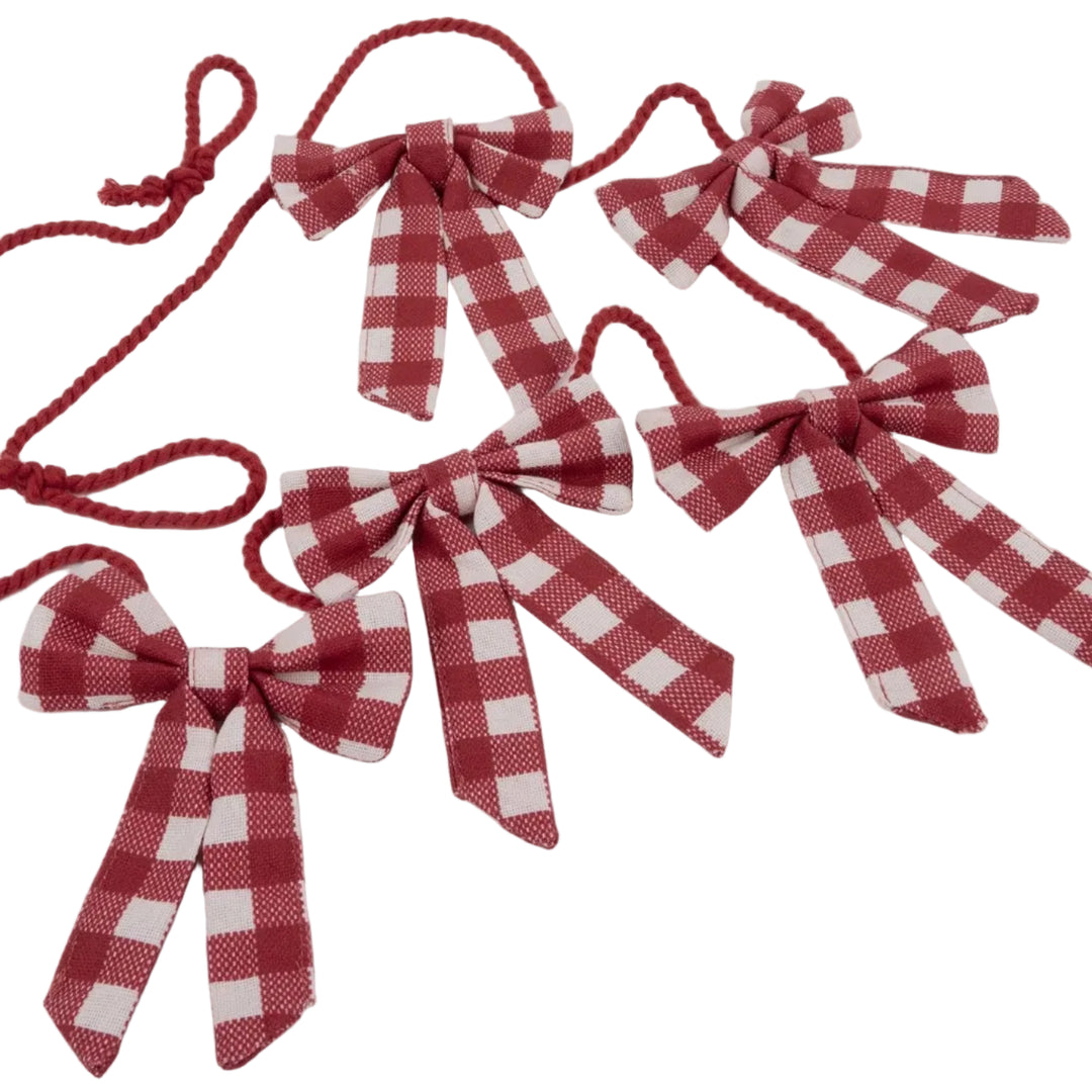 Five red and white gingham check ribbon bows with red hanging loops, arranged on a plain white background.