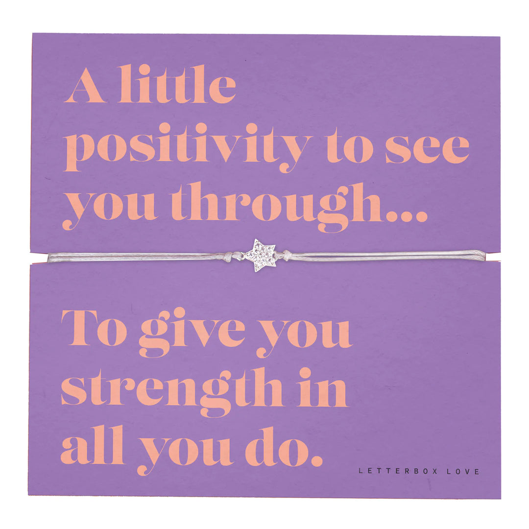 Letterbox Love friendship bracelet with positive sentiment charms, featuring colorful beads and a delicate adjustable cord.