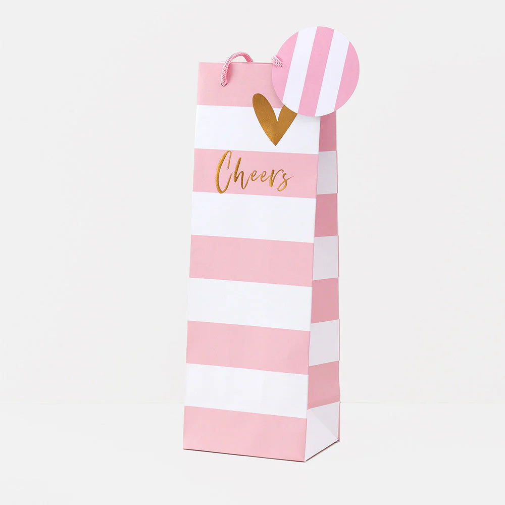 Pink stripe gift bag with "Belly Button" branding by Cornucopia Home and Gift, featuring a sturdy handle and vibrant design.