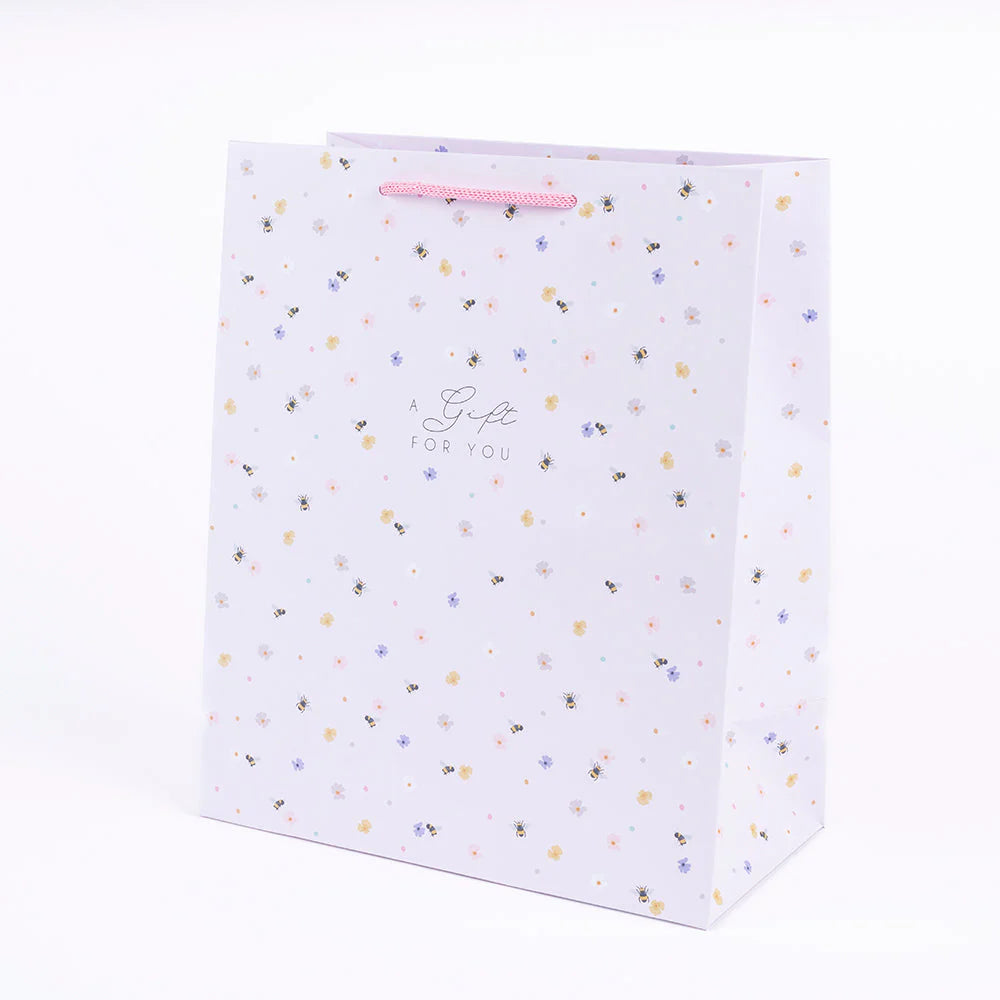 Pink bee portrait gift bag with belly button design by Cornucopia Home and Gift, featuring vibrant bee artwork.