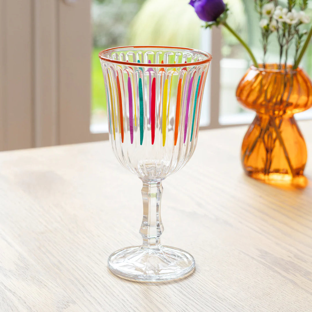 Bright multicolour striped wine glass by Cornucopia Home and Gift, featuring a vibrant, colorful design perfect for wine gatherings.