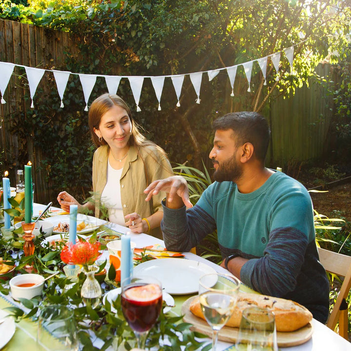 White cotton fabric bunting with 4-meter length from Talking Tables by Cornucopia Worcester, featuring hanging fabric flags.