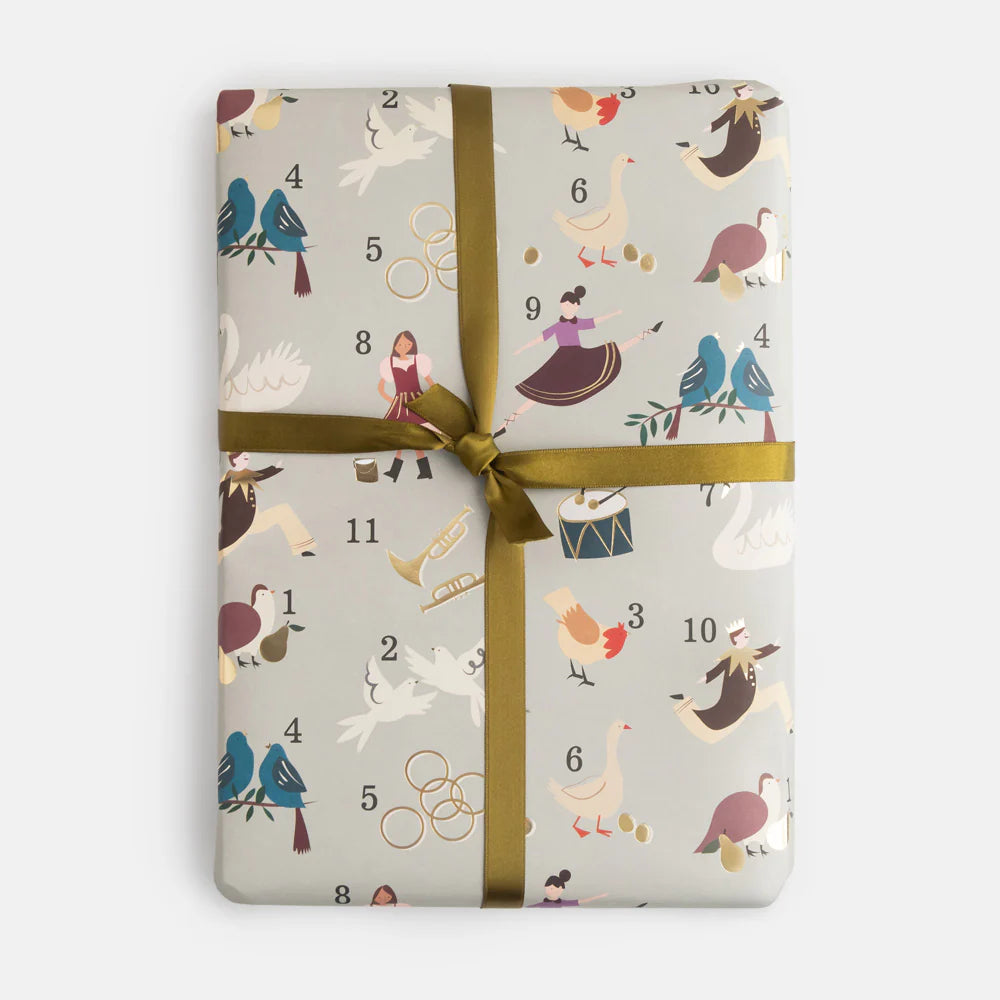 Caroline Gardner Christmas 12 Days of Christmas icons on grey flat wrap, featuring festive holiday illustrations for gift wrapping.