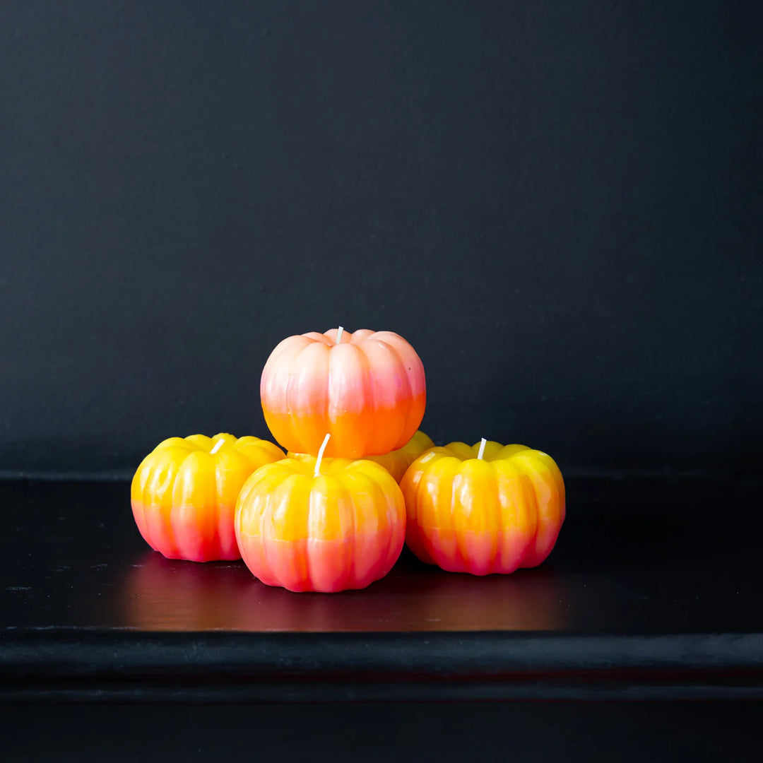 Yellow ombre pumpkin-shaped candle for Halloween by Cornucopia Home and Gift, featuring a pumpkin design with warm candlelight.