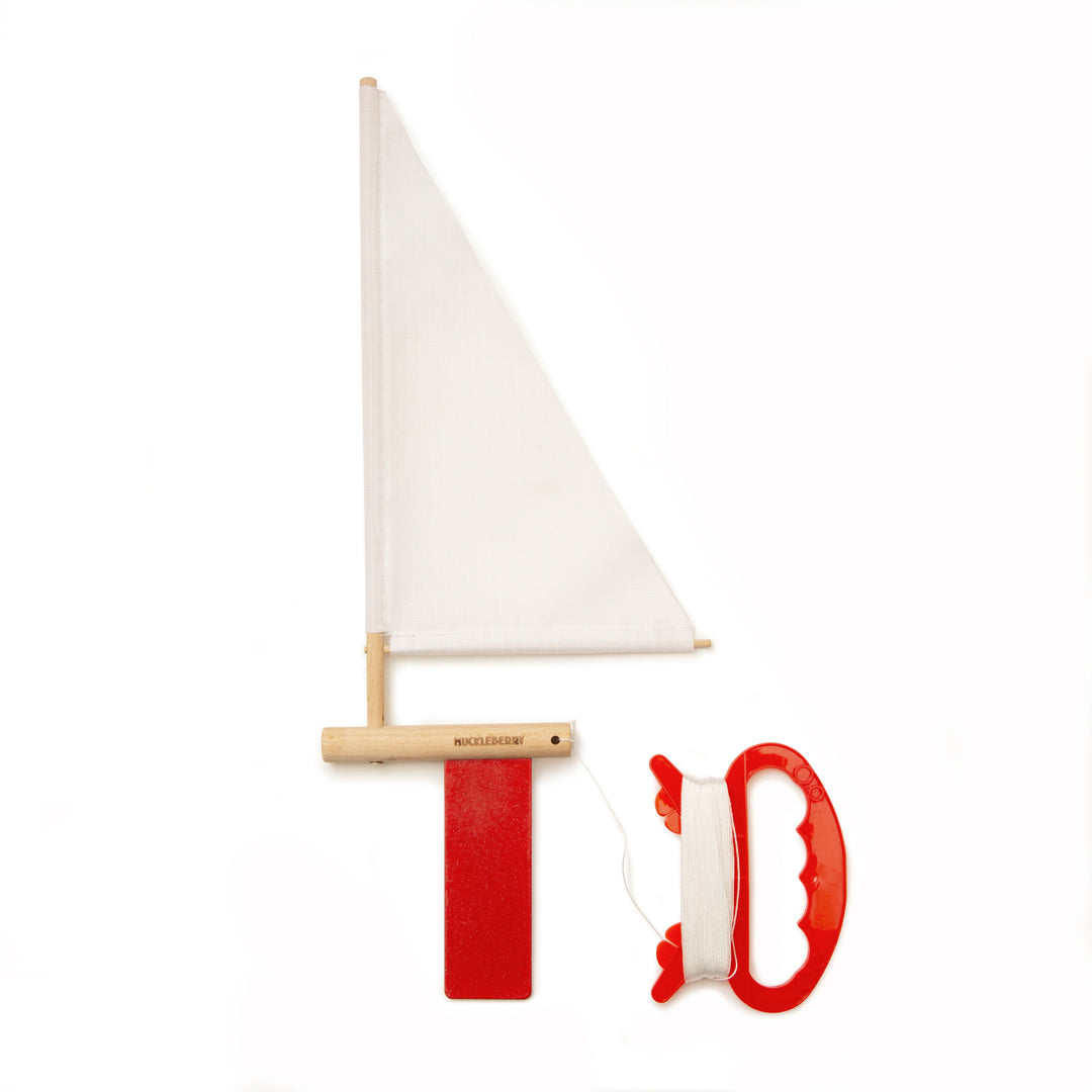 Kikkerland Huckleberry Sailboat decorative item with white hull and colorful sails, perfect for nautical-themed home decor.