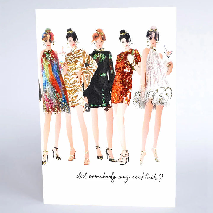 Five Dollar Shake "Did Somebody Say Cocktails?" decorative sign by Cornucopia Home and Gift, featuring colorful cocktail illustrations.