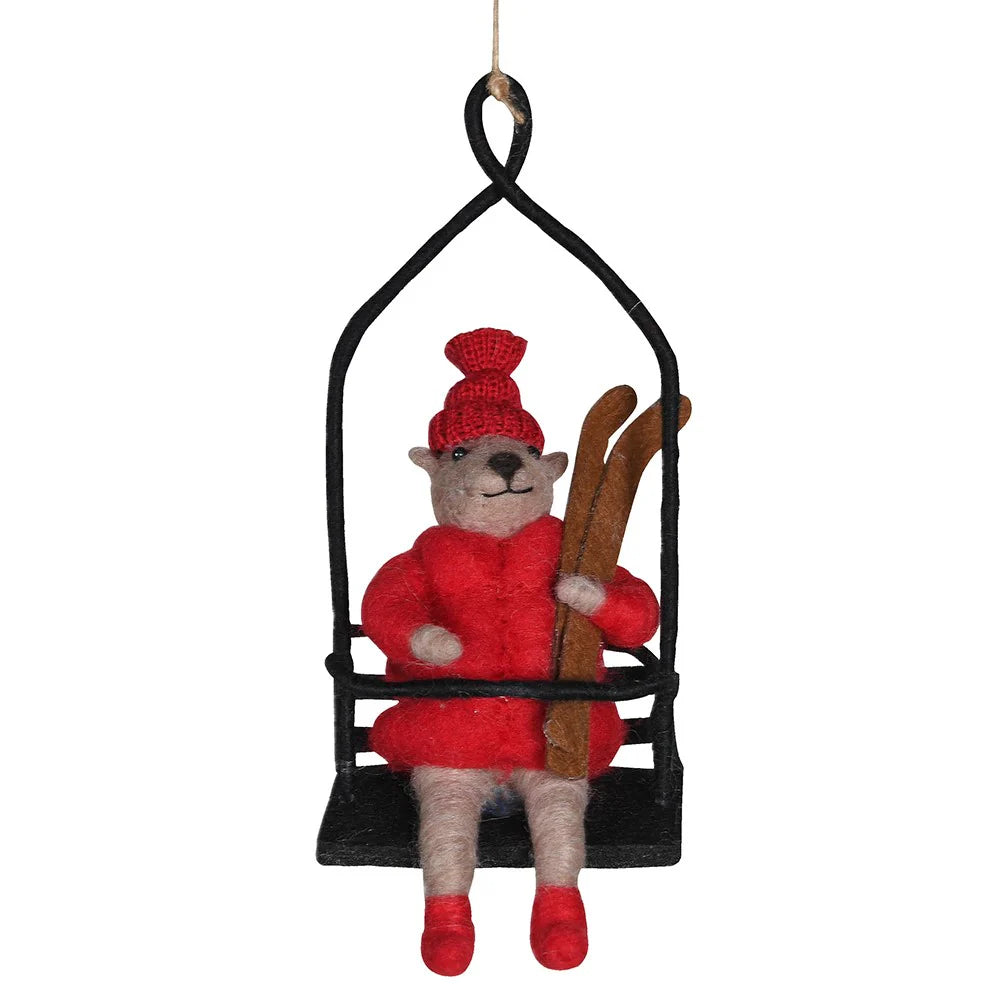 Hanging Toby coach house Christmas ornament by Cornucopia Home, depicting a festive skier ready for après ski.