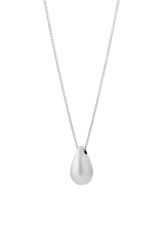 Silver Hush Necklace by Tutti & Co featuring a delicate chain and minimalist pendant, styled on a neutral background.