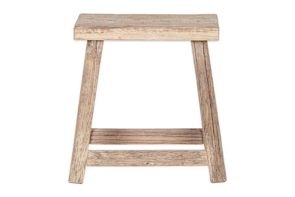 Nkuku Ibo side table by Cornucopia Home and Gift, made from reclaimed wood, showcasing a natural low stool design with a smooth finish.