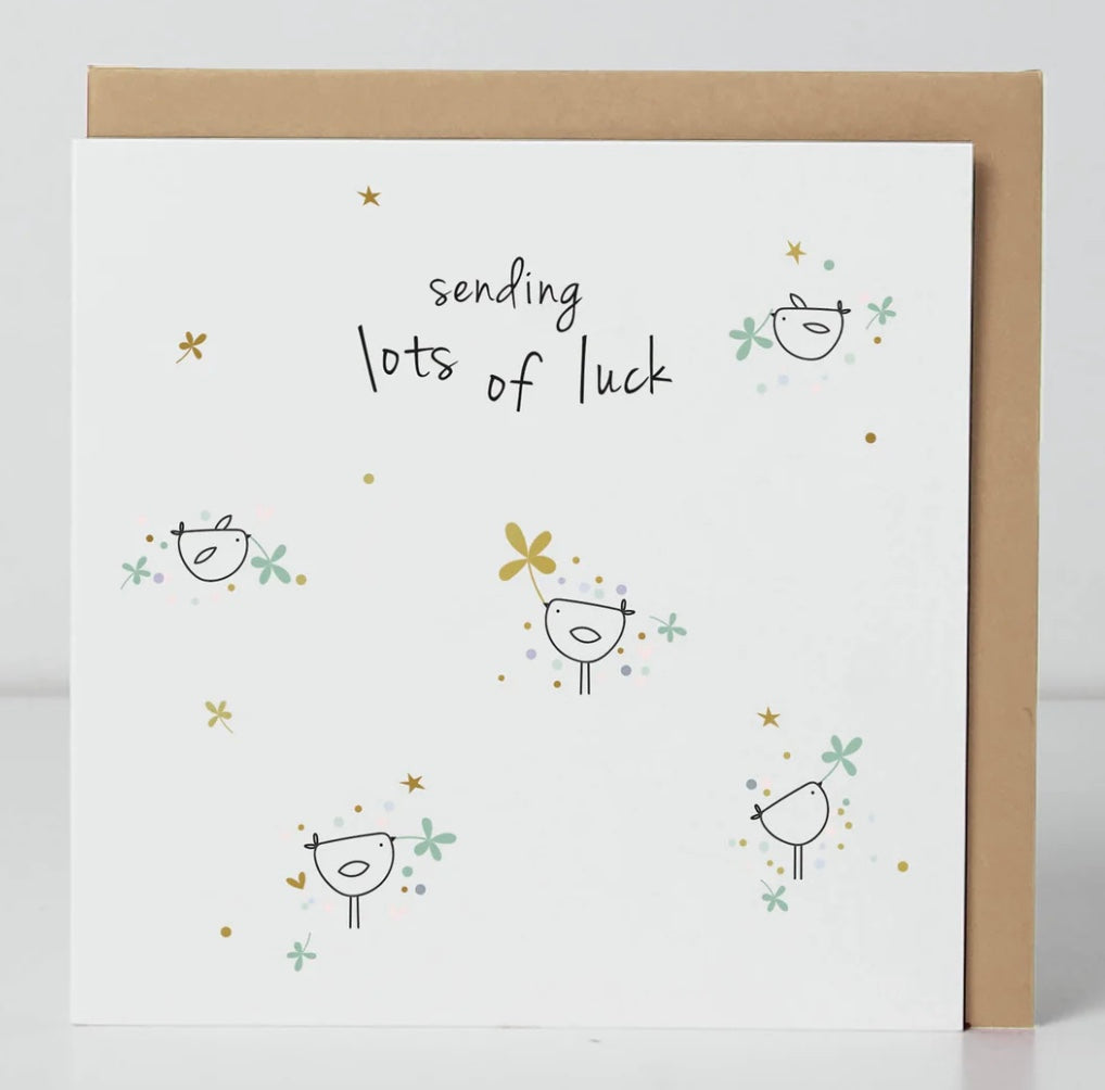 Belly button-shaped good luck card from Cornucopia Home and Gift, featuring colorful design and cheerful message.