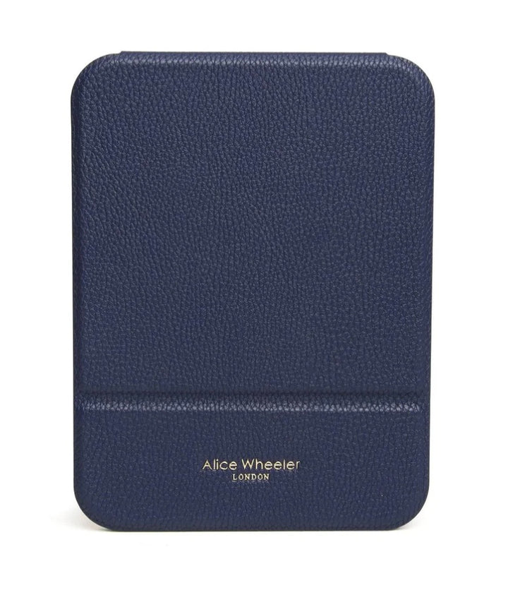 Alice Wheeler navy folding travel mirror showing compact design with adjustable stand and reflective surface for on-the-go use.