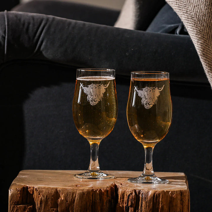 Set of 2 Highland Cow craft beer glasses by Selbrae House, featuring detailed Highland Cow design on clear glass.