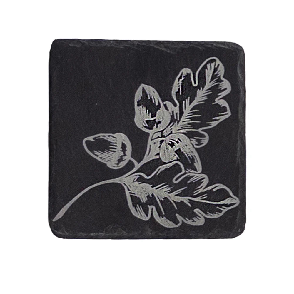 Selbrae House single slate coaster with autumn acorns design, showcasing a natural slate surface with autumnal oak leaf and acorn imagery.
