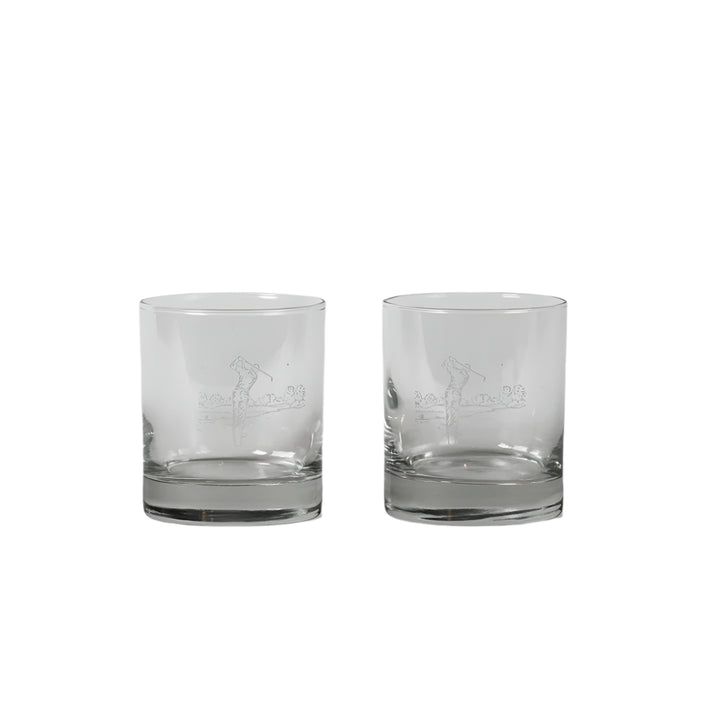 Set of 2 Selbrae House golf-themed glass tumblers with engraved golf ball and tee designs, perfect for outdoor or casual drinking.