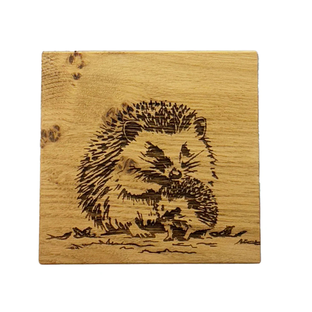 Selbrae House Woodland Hedgehogs single oak coaster with engraved woodland scene, natural wood finish, designed by Cornucopia Home and Gift.