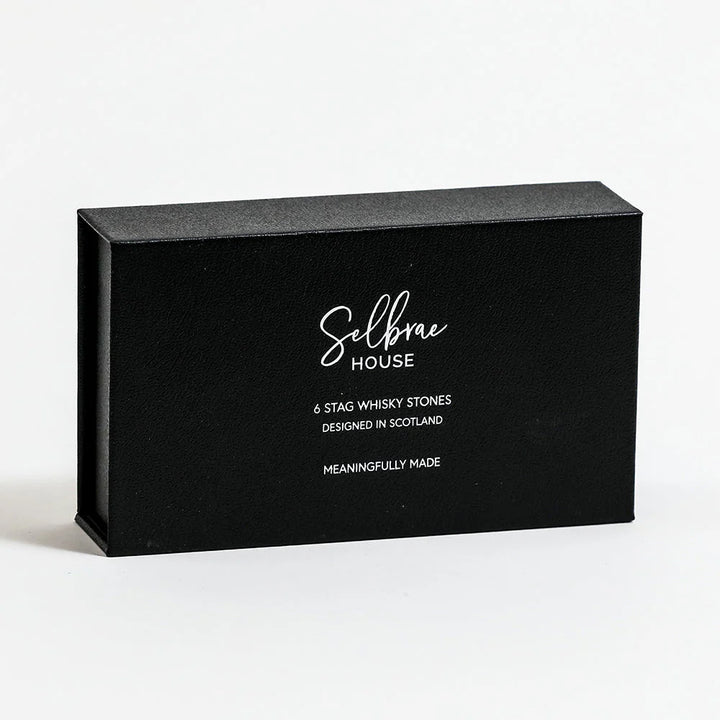 Set of six Selbrae House Stag Whisky Stones by Cornucopia Home and Gift, shown in a clear container with textured finish
