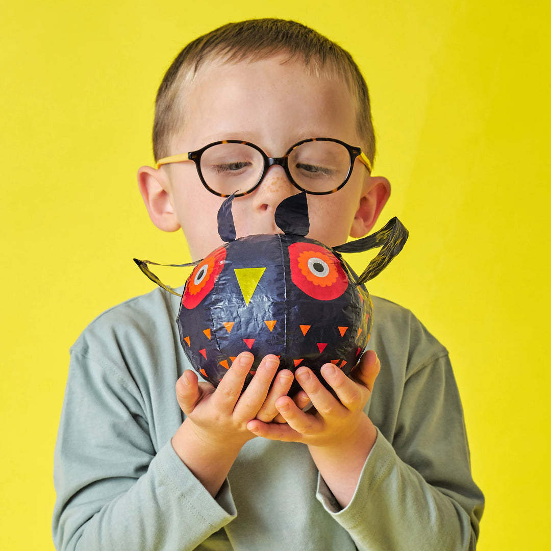Colorful paper balloons by Kikkerland for Cornucopia Home and Gift, featuring vibrant designs and lightweight, festive decoration.