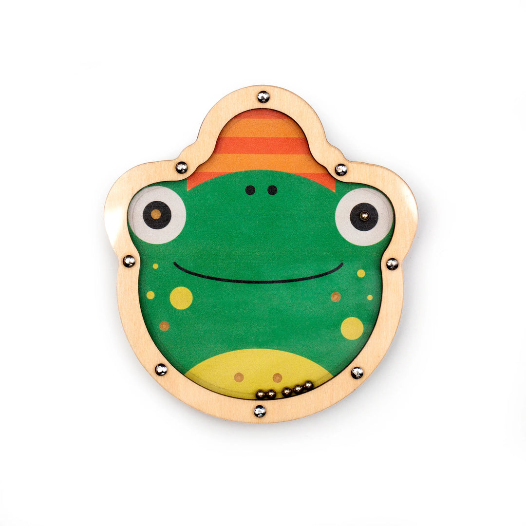 Kikkerland Kidoki Double Sided Tilt &amp; Roll Puzzle by Cornucopia Home featuring colorful, textured puzzle pieces on a flat surface.