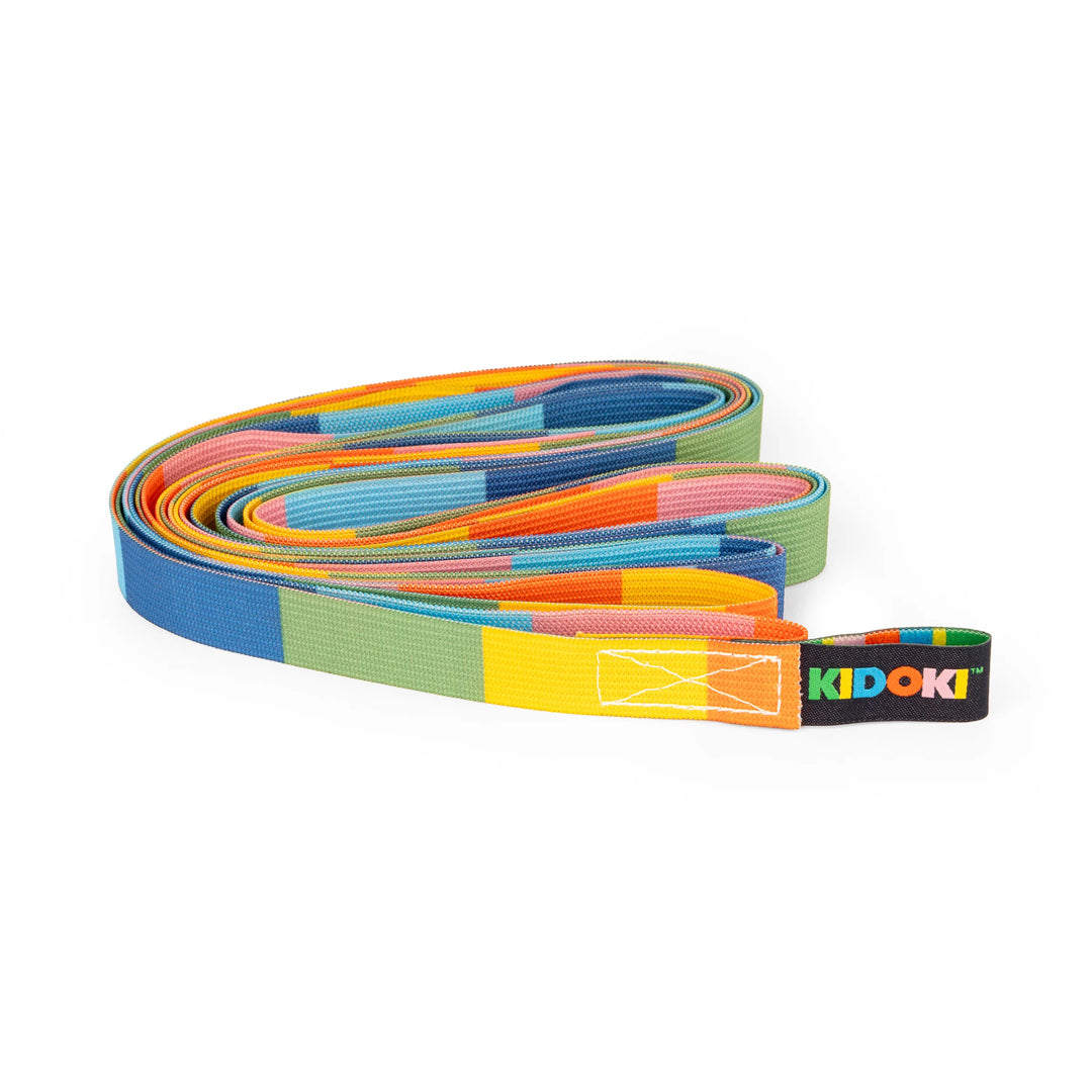 Kikkerland Frog Jumpsies French skipping rope with elastic band, colorful toy for kids, on white background.