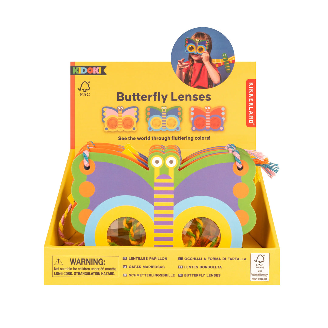 Kikkerland Butterfly Prism Lens in packaging, colorful geometric design, transparent glass prism for decorative use.