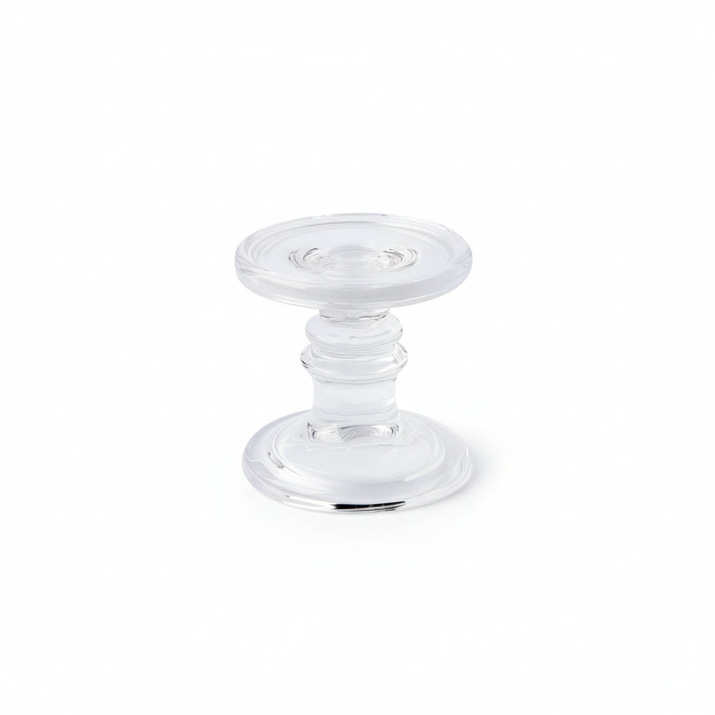 Clear glass candle holder from Cornucopia Home and Gift's Ideal Home Range, perfect for holding candles and enhancing home decor.