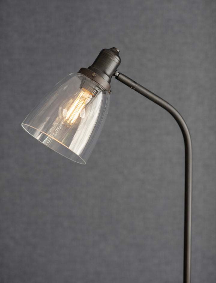 Cornucopia Home and Gift Hoxton Dome Floor Lamp in garden setting with a sleek, modern design and a dome-shaped shade.