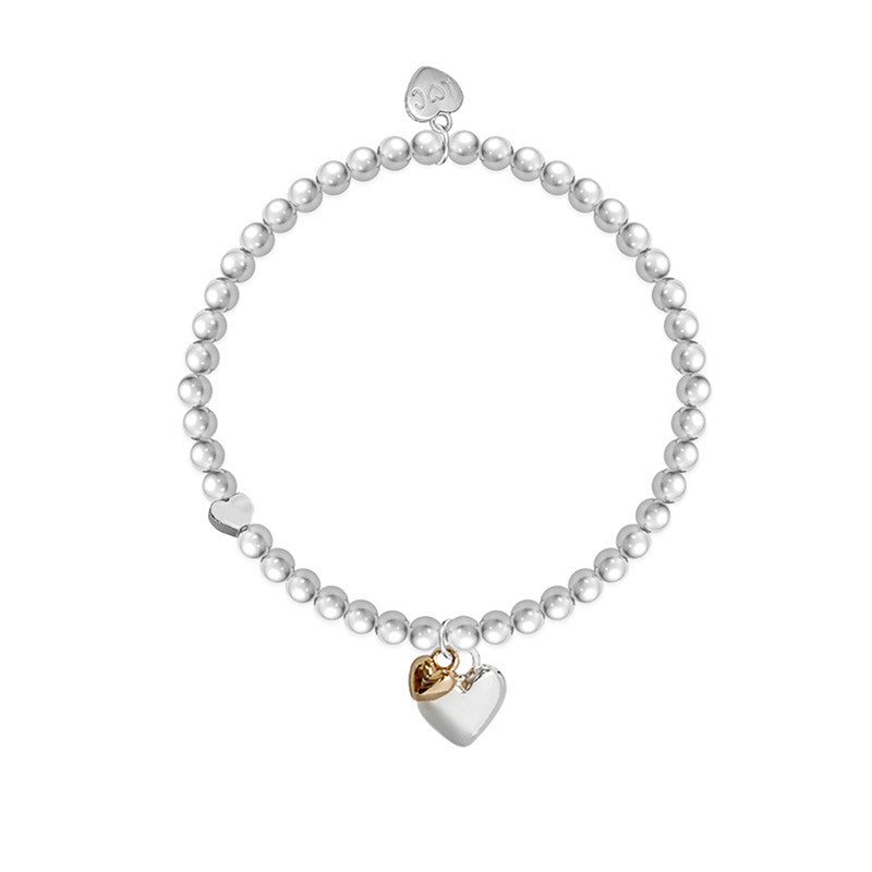 Silver heart-shaped charm bracelet from Cornucopia Home and Gift with "You Are 50" engraved, featuring life charms and delicate chain.