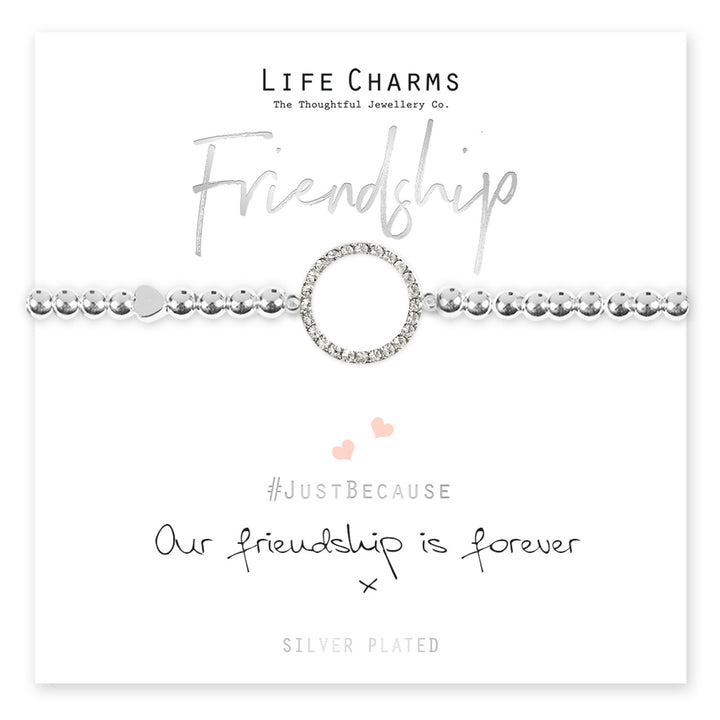 Colorful friendship forever bracelet with life charms from Cornucopia Home and Gift, featuring woven design and small decorative charms.