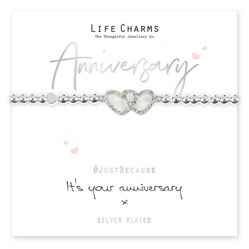 Silver anniversary bracelet with life charms from Cornucopia Home and Gift featuring decorative charms on a delicate chain.