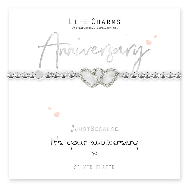 Silver anniversary bracelet with life charms from Cornucopia Home and Gift featuring decorative charms on a delicate chain.