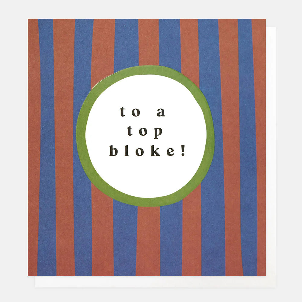 Red and blue striped ceramic mug by Caroline Gardner, featuring playful "To a top bloke!" design for Cornucopia Home and Gift.