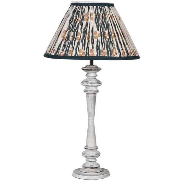 Wash Wood Table Lamp with Ikat Shade by Cornucopia Home features a wooden base and patterned fabric shade.