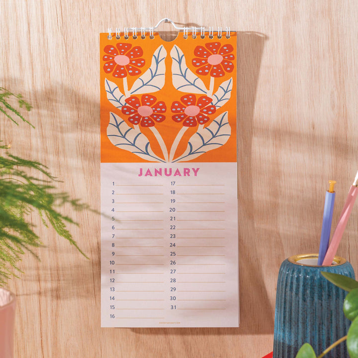 Close-up of Cornucopia Home and Gift Les Fleurs birthday calendar showing floral design and detailed date sections.