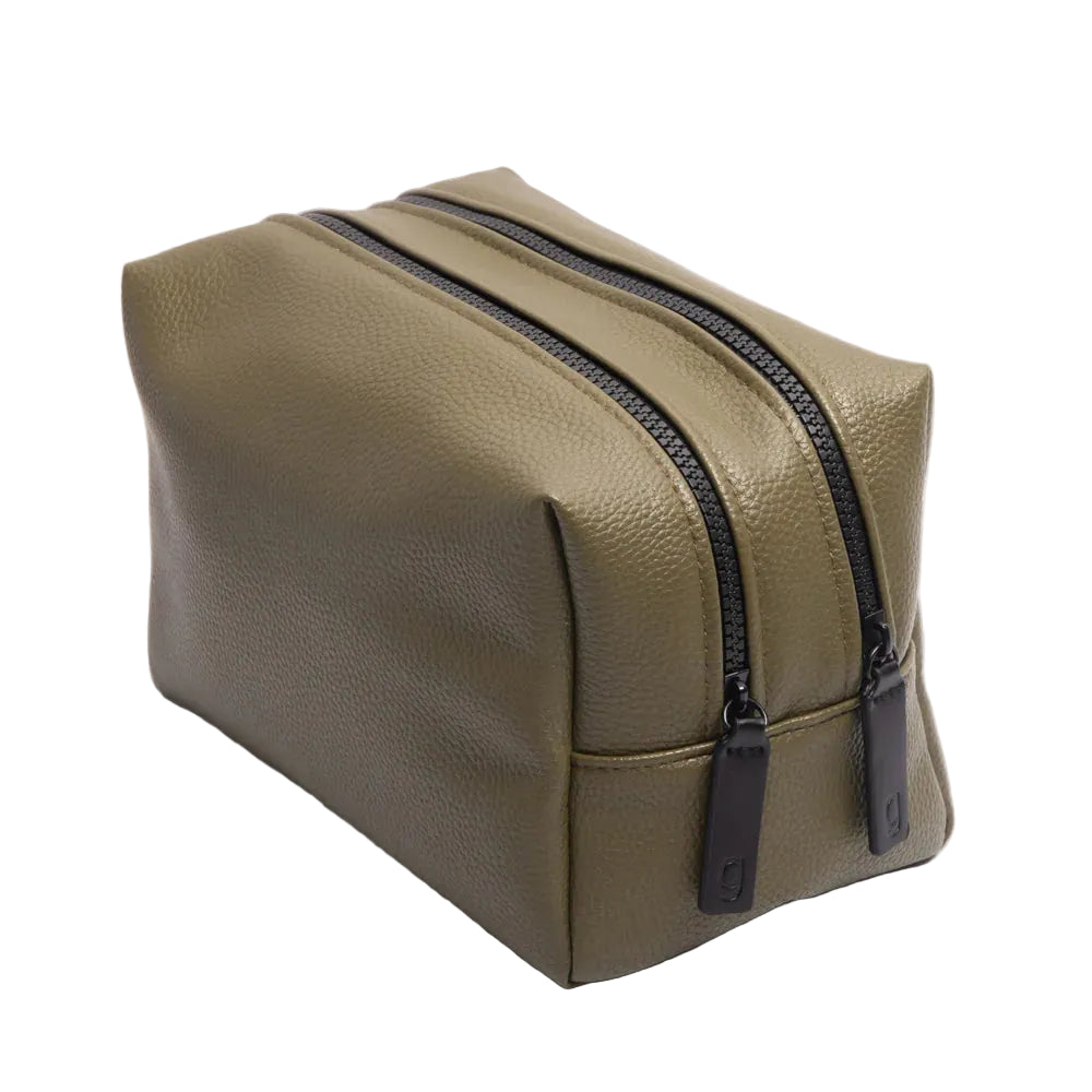 Dark green Caroline Gardner large travel washbag with a spacious design, perfect for organizing toiletries on the go.