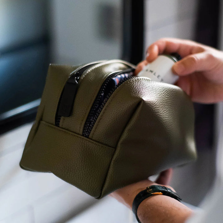 Large Caroline Gardner dark green travel washbag with spacious compartments, perfect for men&
