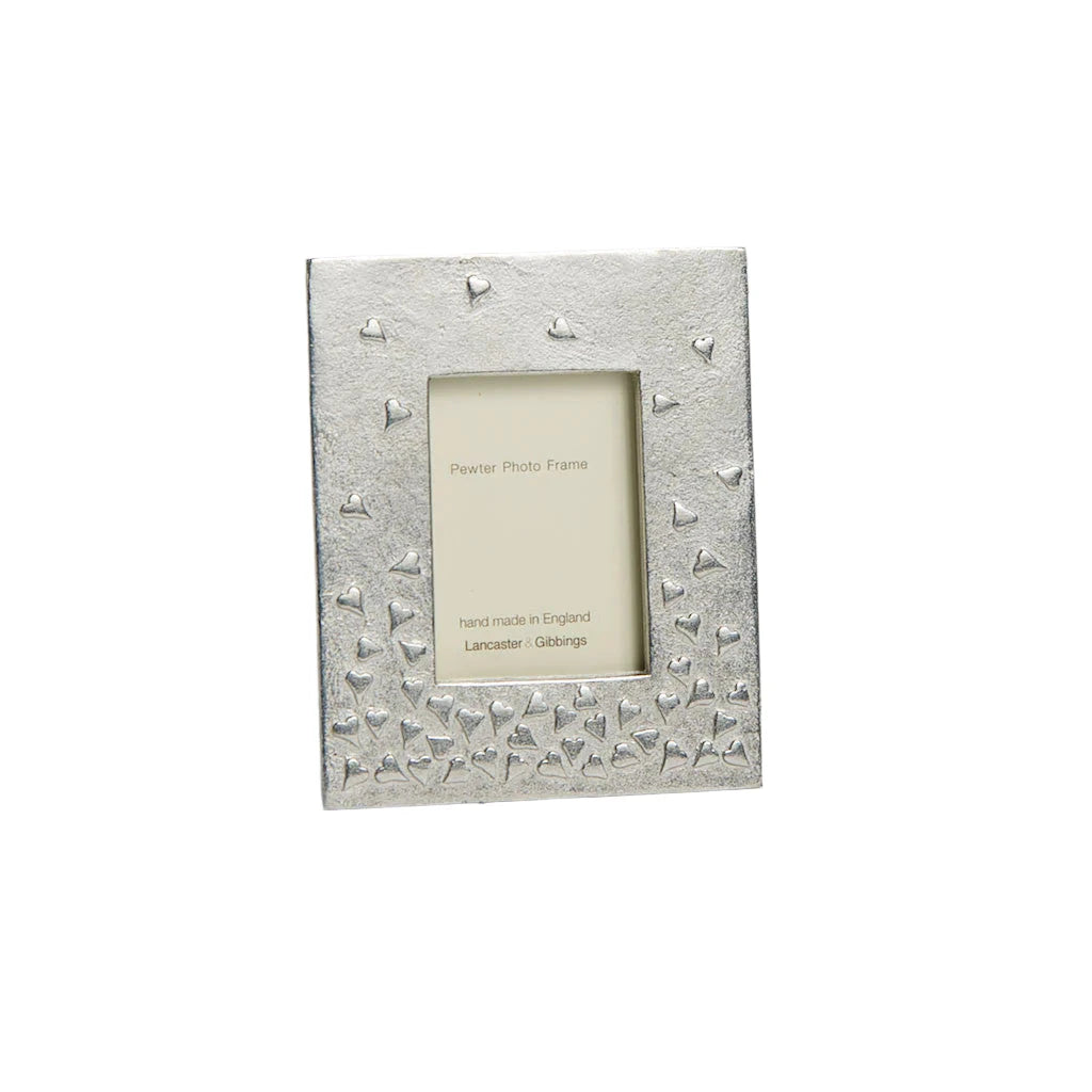 Handmade small pewter floating hearts photo frame by Lancaster and Gibbings, featuring delicate heart accents for home decor.