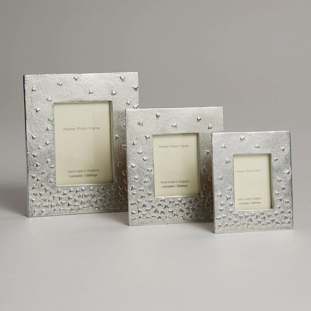 Handmade medium floating hearts mini photo frame by Lancaster and Gibbings for Cornucopia Home and Gift, with decorative floating heart design.