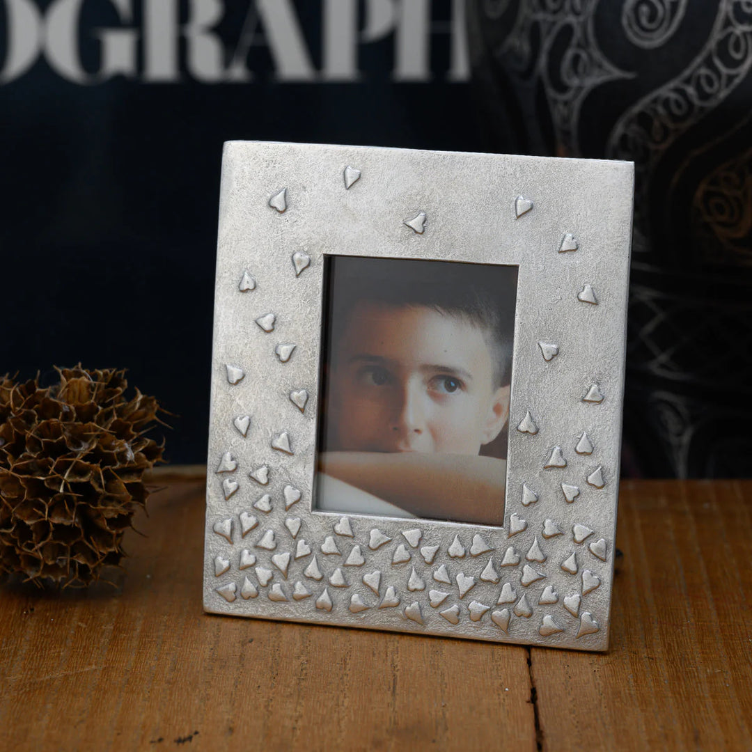 Handmade medium floating hearts mini photo frame by Lancaster and Gibbings, with clear glass and decorative heart accents, for home decor.