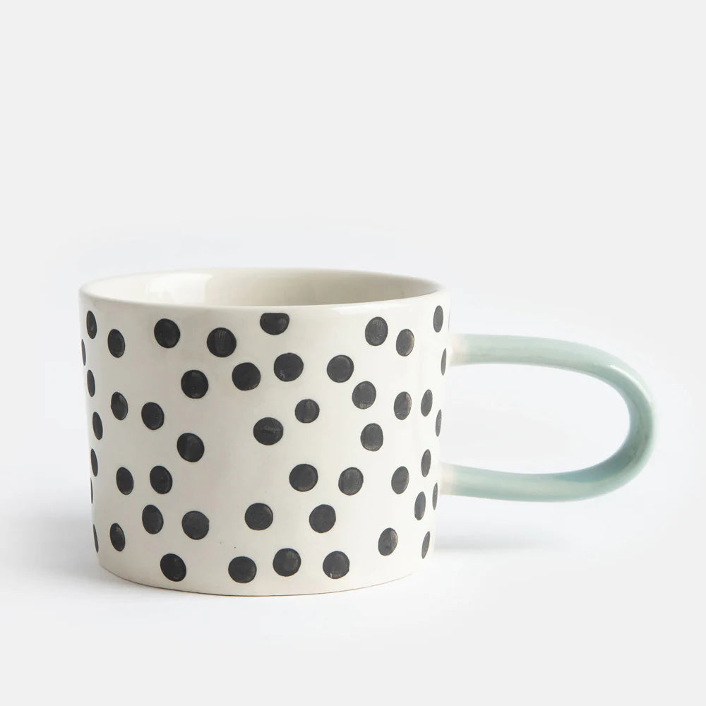 Caroline Gardner Mono Ditsy Spot Mug featuring a charming dotted pattern, perfect for tea or coffee drinking.