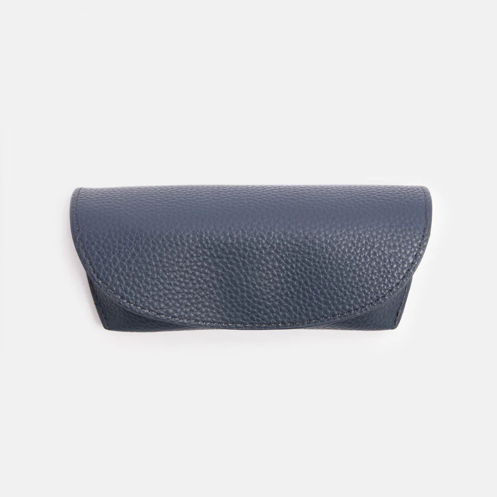 Caroline Gardner navy flap glasses case with a secure closure, designed to protect and store eyeglasses in style.